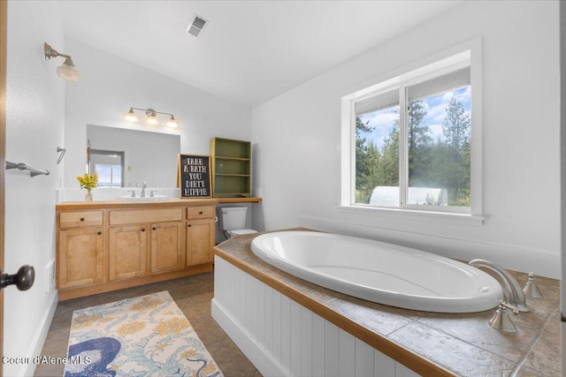 14250 W Sunmeadow Rd, Worley, ID 83876 - full bath featuring vaulted ceiling, vanity, a garden tub, and healthy amount of natural light
