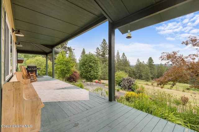 14250 W Sunmeadow Rd, Worley, ID 83876 - wooden deck featuring a grill and a patio