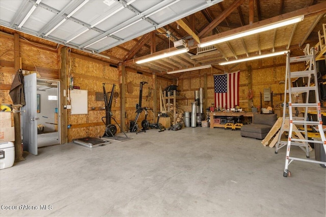 14250 W Sunmeadow Rd, Worley, ID 83876 - garage with a workshop area and a garage door opener