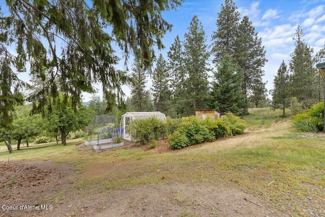 14250 W Sunmeadow Rd, Worley, ID 83876 - view of grassy yard with a vegetable garden