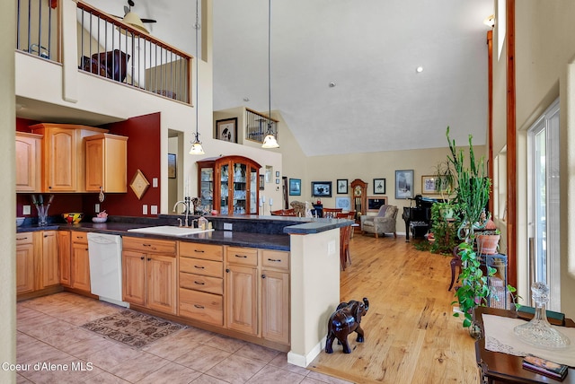 1600 Shepherd Rd, Saint Maries, ID 83861 - kitchen featuring white dishwasher, high vaulted ceiling, a peninsula, dark countertops, and open floor plan