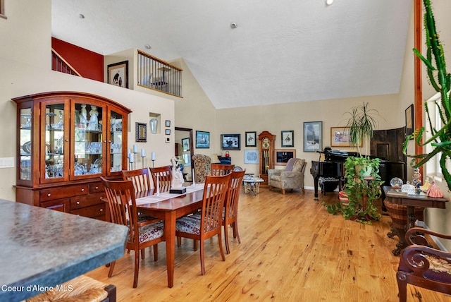 1600 Shepherd Rd, Saint Maries, ID 83861 - dining area with high vaulted ceiling and light wood-style flooring