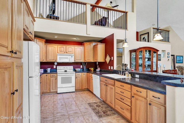1600 Shepherd Rd, Saint Maries, ID 83861 - kitchen with white appliances, a peninsula, high vaulted ceiling, dark countertops, and decorative light fixtures