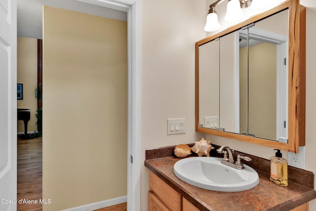 1600 Shepherd Rd, Saint Maries, ID 83861 - bathroom featuring vanity and wood finished floors