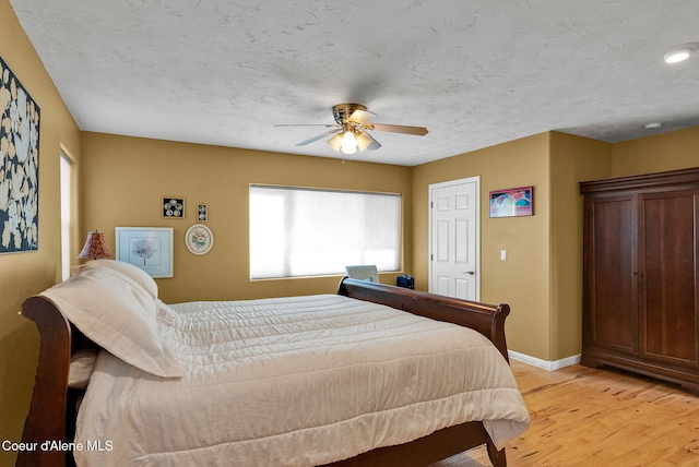 1600 Shepherd Rd, Saint Maries, ID 83861 - bedroom featuring light wood-type flooring, a ceiling fan, and a textured ceiling