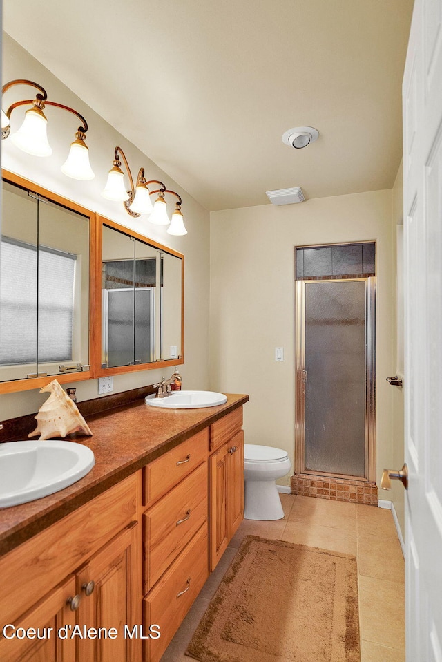 1600 Shepherd Rd, Saint Maries, ID 83861 - full bath featuring double vanity, a stall shower, and tile patterned floors