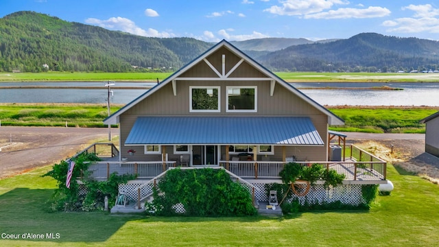 1600 Shepherd Rd, Saint Maries, ID 83861 - farmhouse featuring a water and mountain view, a front lawn, and a metal roof