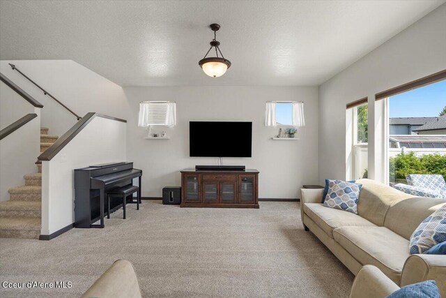 1824 E Warbler Ln, Post Falls, ID 83854 - living area with light colored carpet and stairs
