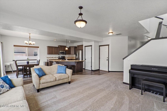 1824 E Warbler Ln, Post Falls, ID 83854 - carpeted living area with a chandelier and a textured ceiling