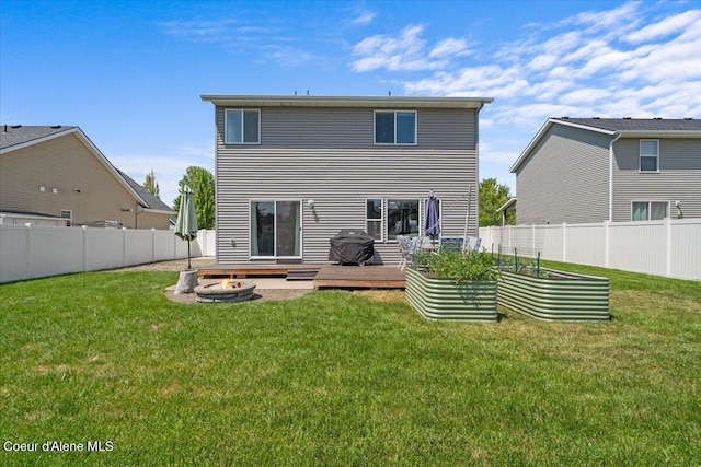 1824 E Warbler Ln, Post Falls, ID 83854 - rear view of house featuring an outdoor fire pit, a garden, and a fenced backyard