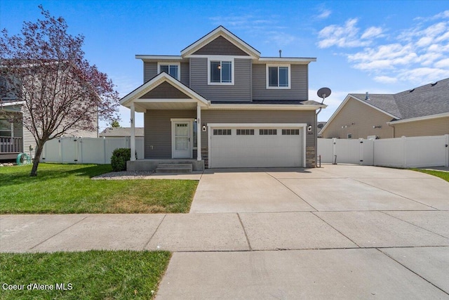 1824 E Warbler Ln, Post Falls, ID 83854 - view of front of home with a garage, concrete driveway, a gate, and stone siding