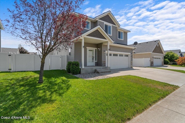 1824 E Warbler Ln, Post Falls, ID 83854 - view of front of property with driveway, a garage, and stone siding
