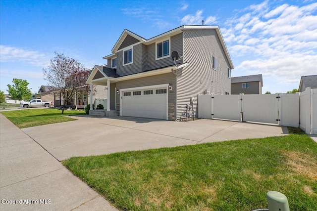 1824 E Warbler Ln, Post Falls, ID 83854 - view of front of house featuring a gate, an attached garage, driveway, and stone siding