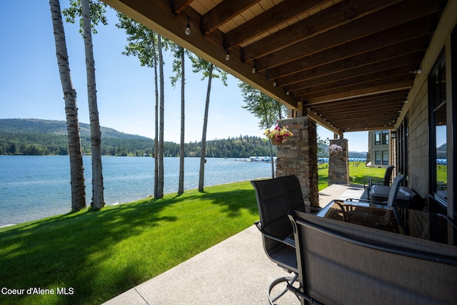 653 Dover Bay Pkwy Unit 101, Dover, ID 83825 - view of patio / terrace featuring a water view