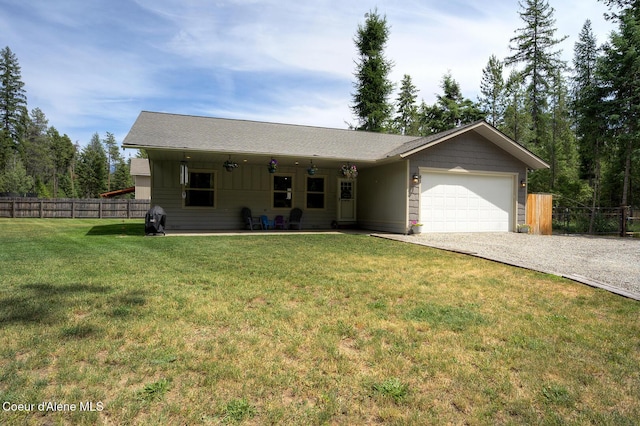 81 Mango St, Moyie Springs, ID 83845 - ranch-style home featuring a garage, gravel driveway, and board and batten siding