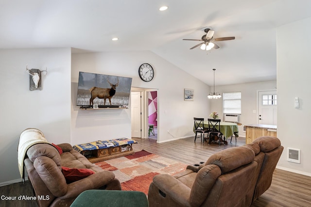 81 Mango St, Moyie Springs, ID 83845 - living room featuring wood finished floors, ceiling fan, vaulted ceiling, cooling unit, and recessed lighting