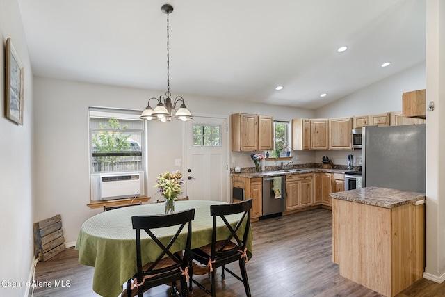 81 Mango St, Moyie Springs, ID 83845 - kitchen featuring appliances with stainless steel finishes, light brown cabinetry, a chandelier, dark wood-style floors, and hanging light fixtures