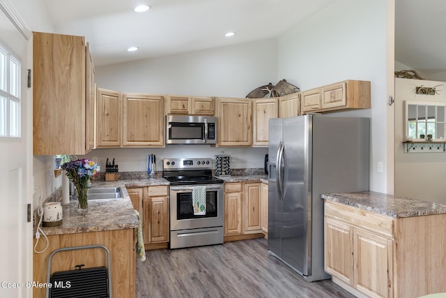 81 Mango St, Moyie Springs, ID 83845 - kitchen with appliances with stainless steel finishes, light brown cabinets, lofted ceiling, light wood-style flooring, and recessed lighting