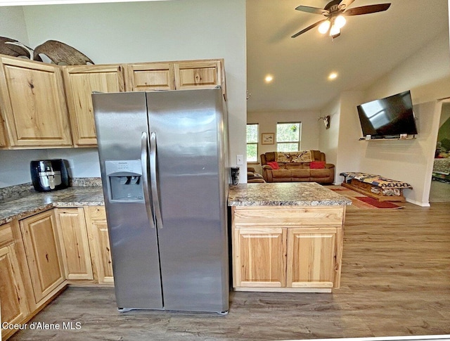 81 Mango St, Moyie Springs, ID 83845 - kitchen featuring stainless steel refrigerator with ice dispenser, light brown cabinets, light wood-style floors, ceiling fan, and lofted ceiling