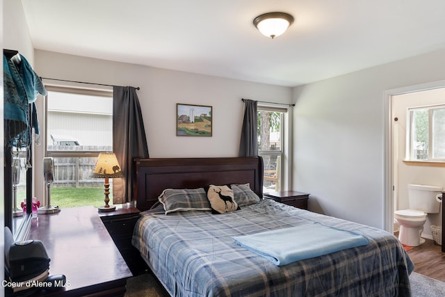 81 Mango St, Moyie Springs, ID 83845 - bedroom featuring multiple windows, wood finished floors, and connected bathroom