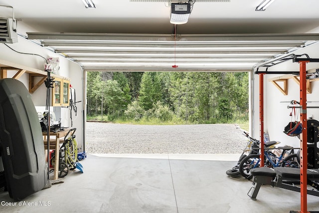 81 Mango St, Moyie Springs, ID 83845 - garage featuring a garage door opener and a heating unit