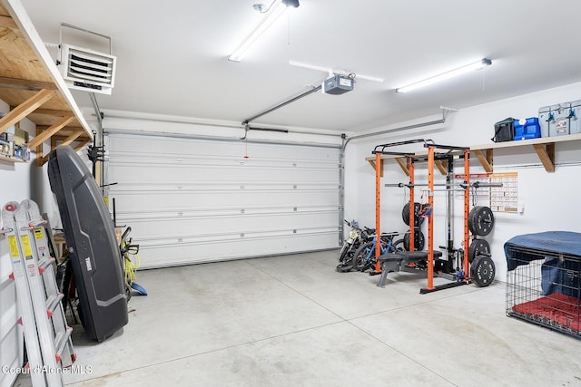 81 Mango St, Moyie Springs, ID 83845 - garage featuring a garage door opener and a heating unit
