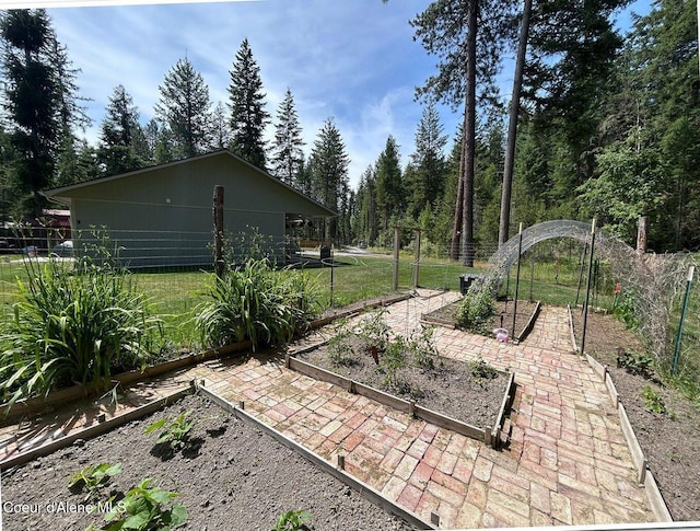 81 Mango St, Moyie Springs, ID 83845 - view of patio featuring a vegetable garden
