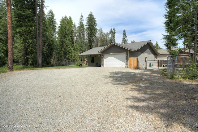 81 Mango St, Moyie Springs, ID 83845 - view of front of property with a garage and gravel driveway