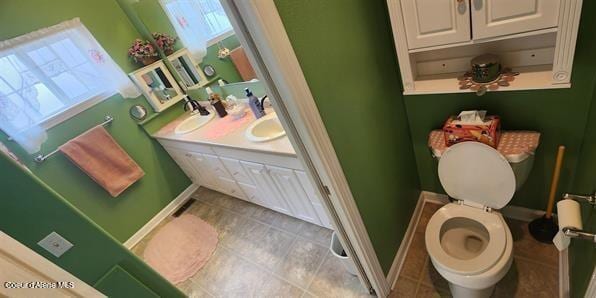 817 6th St, Kamiah, ID 83536 - bathroom with tile patterned floors and double vanity