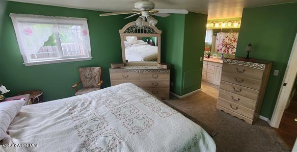 817 6th St, Kamiah, ID 83536 - carpeted bedroom with baseboards and a ceiling fan