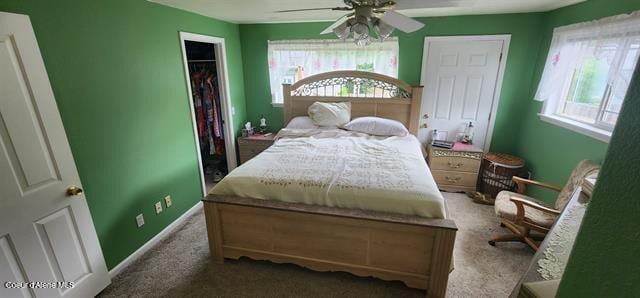 817 6th St, Kamiah, ID 83536 - carpeted bedroom featuring multiple windows, a closet, and a ceiling fan