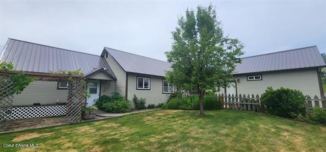 817 6th St, Kamiah, ID 83536 - back of house featuring a metal roof