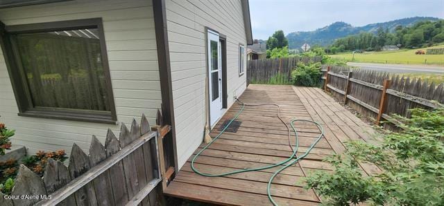 817 6th St, Kamiah, ID 83536 - wooden terrace with a fenced backyard and a mountain view