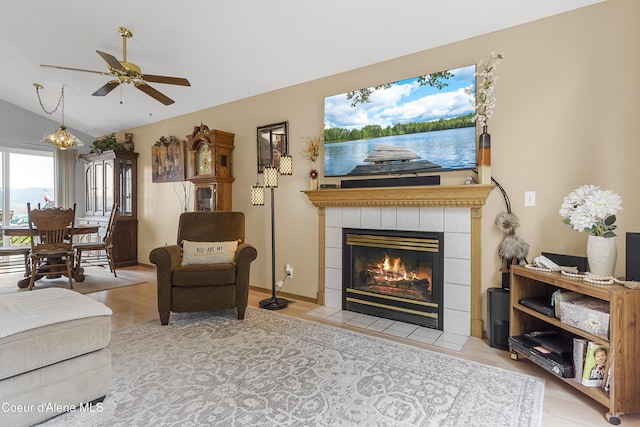 635 N Divot Ave, Post Falls, ID 83854 - living room featuring a ceiling fan, lofted ceiling, a fireplace, and wood finished floors