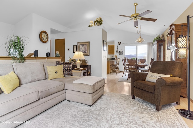 635 N Divot Ave, Post Falls, ID 83854 - living room featuring light wood-style flooring, ceiling fan, and vaulted ceiling