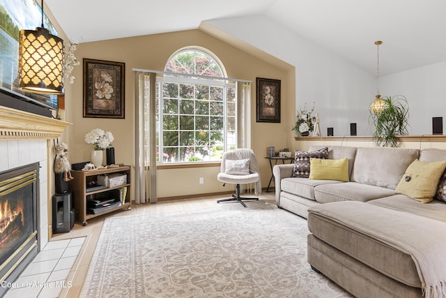 635 N Divot Ave, Post Falls, ID 83854 - living area with plenty of natural light, lofted ceiling, a fireplace, and light wood-style floors