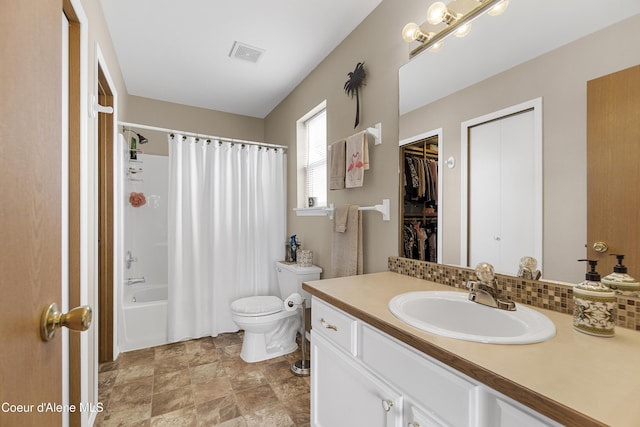 635 N Divot Ave, Post Falls, ID 83854 - full bath featuring vanity, shower / tub combo, stone finish floors, and backsplash