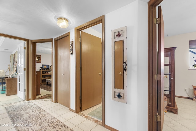 635 N Divot Ave, Post Falls, ID 83854 - hallway with light tile patterned flooring and baseboards
