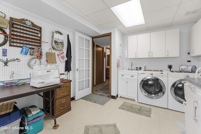 635 N Divot Ave, Post Falls, ID 83854 - washroom featuring cabinet space, washing machine and dryer, and light floors