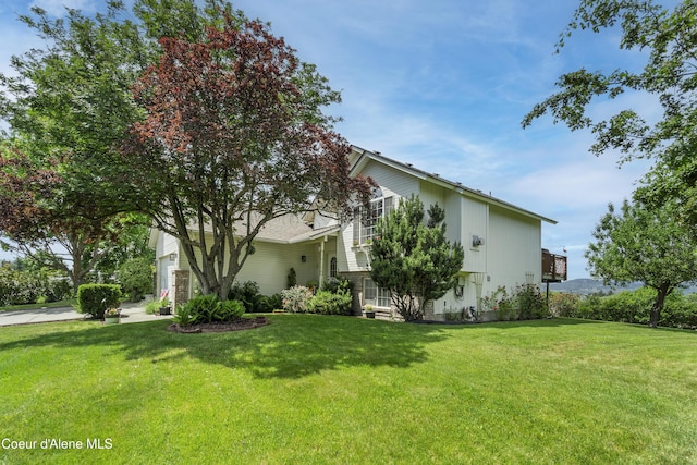 635 N Divot Ave, Post Falls, ID 83854 - view of side of property featuring a yard and a garage