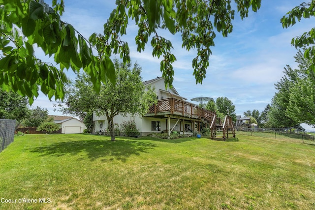 635 N Divot Ave, Post Falls, ID 83854 - view of yard featuring a wooden deck, stairs, and an outbuilding