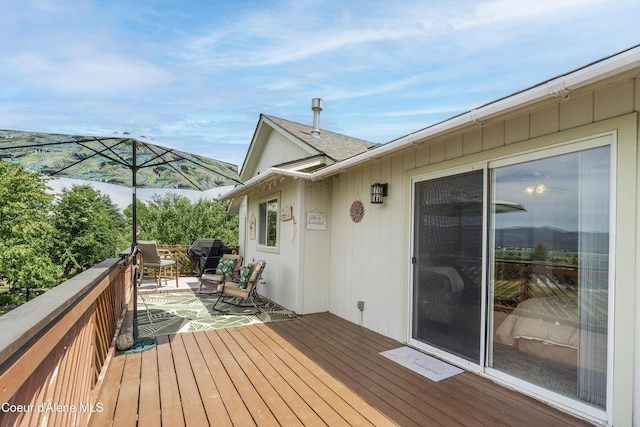 635 N Divot Ave, Post Falls, ID 83854 - wooden terrace featuring a grill