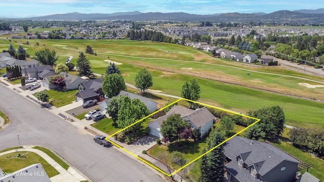635 N Divot Ave, Post Falls, ID 83854 - aerial perspective of suburban area featuring a mountain backdrop and property boundaries highlighted