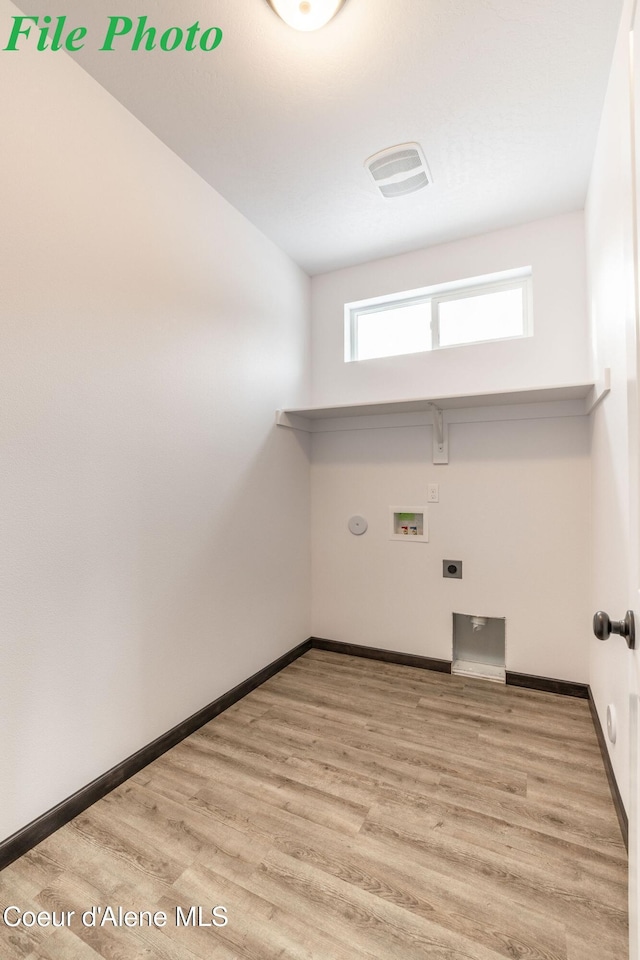 7881 N Mocha Loop, Coeur Dalene, ID 83815 - washroom featuring washer hookup, wood finished floors, and gas dryer hookup