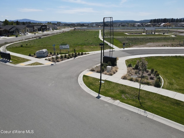 7881 N Mocha Loop, Coeur Dalene, ID 83815 - view of asphalt road featuring a mountain view and curbs