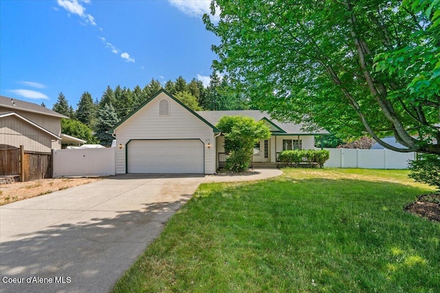 879 E Cloverleaf Dr, Hayden, ID 83835 - view of front facade featuring a garage and concrete driveway