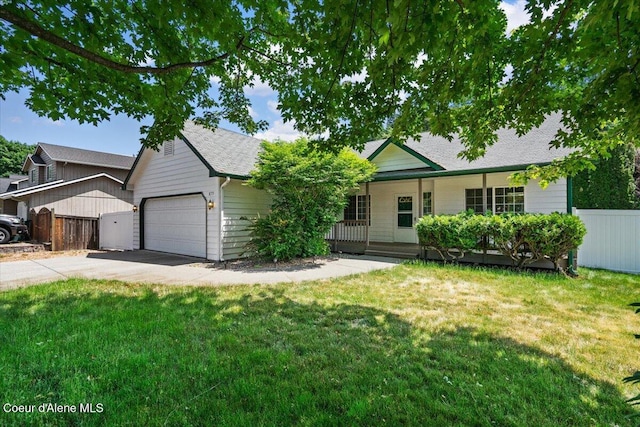879 E Cloverleaf Dr, Hayden, ID 83835 - view of front of property with a garage, driveway, a porch, and roof with shingles