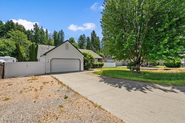 879 E Cloverleaf Dr, Hayden, ID 83835 - view of front of house with a garage, driveway, and a gate