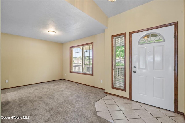 879 E Cloverleaf Dr, Hayden, ID 83835 - foyer with baseboards and light colored carpet