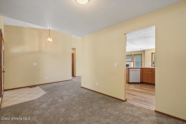 879 E Cloverleaf Dr, Hayden, ID 83835 - unfurnished room with light carpet